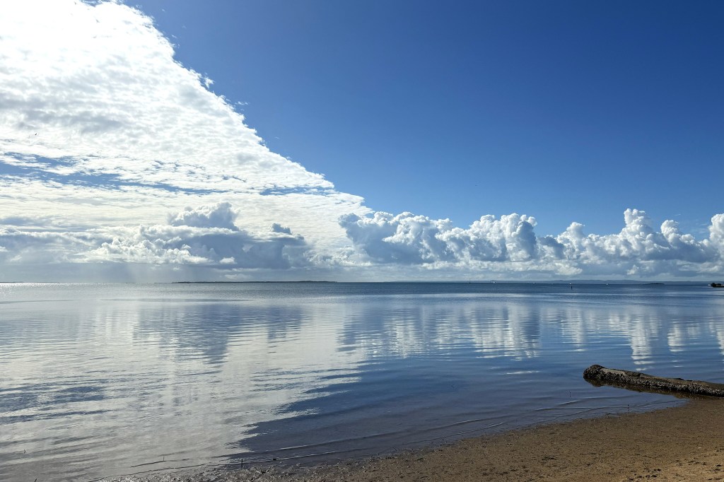 Clouds reflected in the ocean. Copyright Fiona Pennisi-Mitchell.