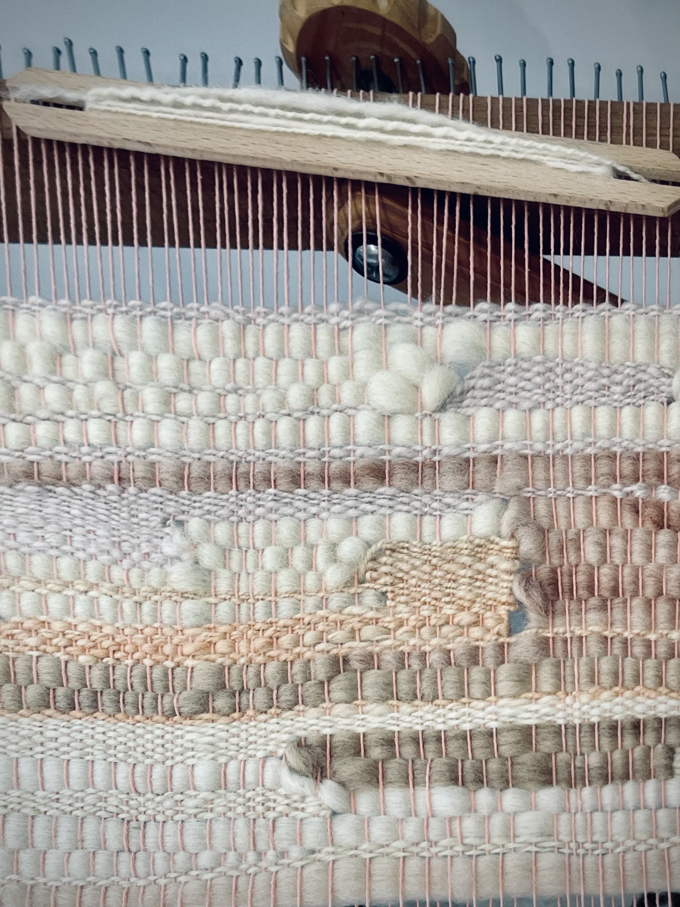 Weaving on a loom.